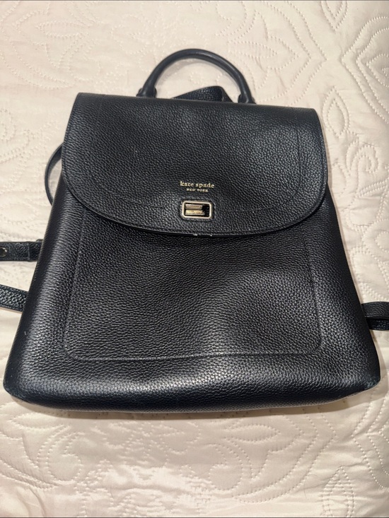 kate spade Handbags - kate spade Black Pebbled Leather Flap Backpack with Gold Hardware